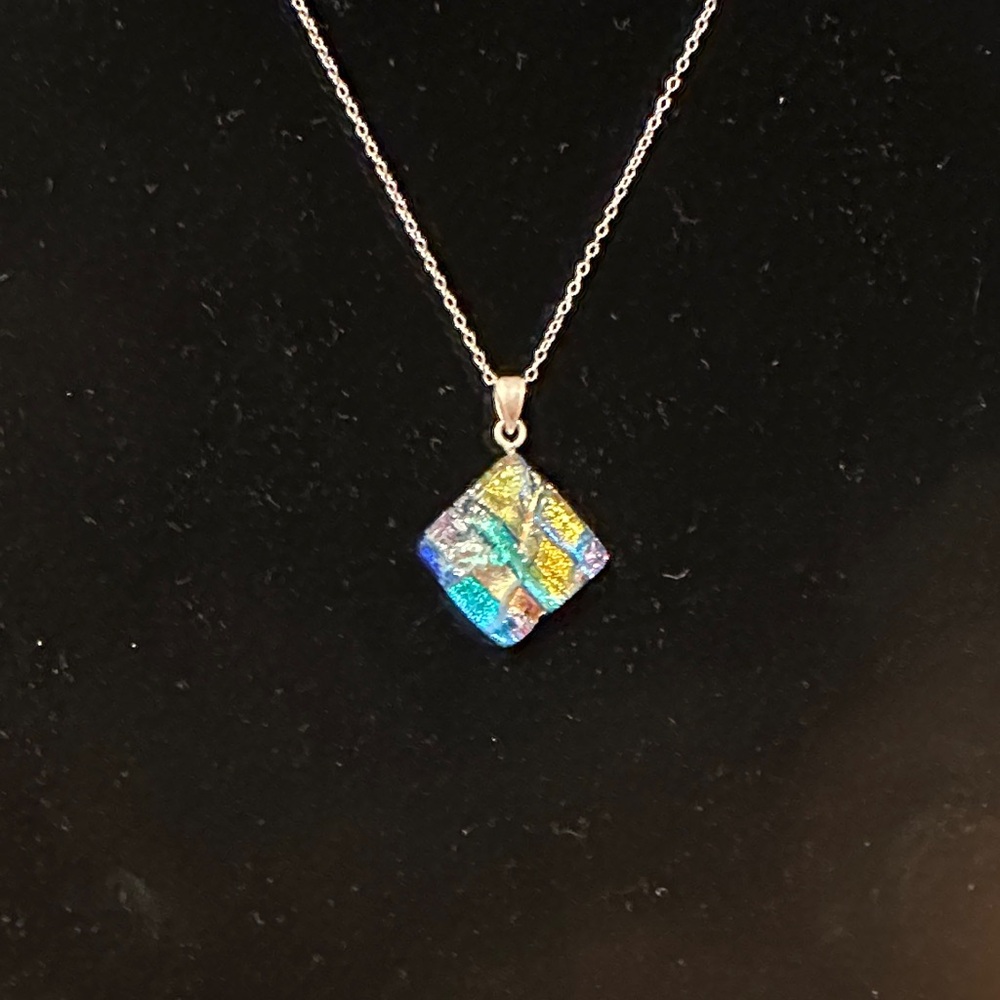Dichroic Square Glass Charm Silver pendant necklace. Pendant is set triangular